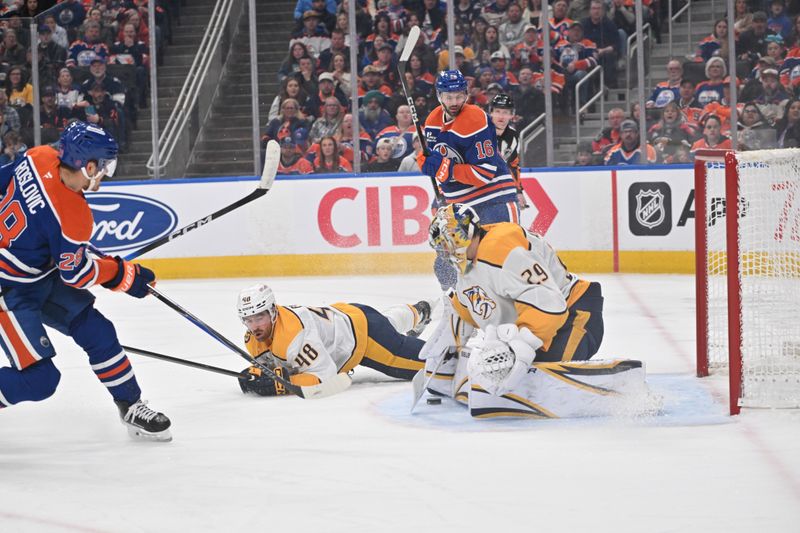 Mar 15, 2026; Edmonton, Alberta, CAN; Edmonton Oilers center Jack Roslovic (28) watches as Nashville Predators defenseman Nick Perbix (48) goes down in front of Nashville Predators goalie Justus Annunen (29) during the third period at Rogers Place. Mandatory Credit: Walter Tychnowicz-Imagn Images Mar 15, 2026; Edmonton, Alberta, CAN; Edmonton Oilers center Jack Roslovic (28) watches as Nashville Predators defenseman Nick Perbix (48) goes down in front of Nashville Predators goalie Justus Annunen (29) during the third period at Rogers Place. Mandatory Credit: Walter Tychnowicz-Imagn Images