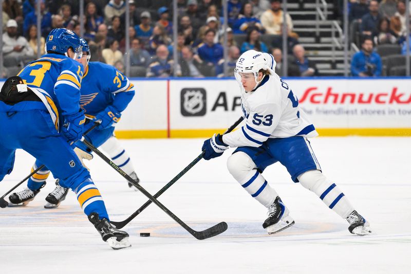 Mar 28, 2026; St. Louis, Missouri, USA; Toronto Maple Leafs right wing Easton Cowan (53) controls the puck against the St. Louis Blues during the first period at Enterprise Center. Mandatory Credit: Jeff Curry-Imagn Images