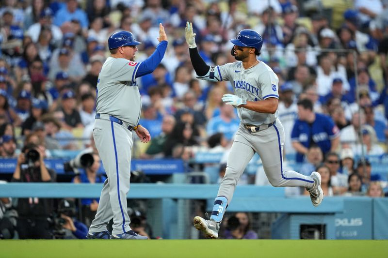 Jun 15, 2024; Los Angeles, California, USA; Kansas City Royals left fielder MJ Melendez (1) celebrates with major league field coordinator, third base coach Vance Wilson after hitting a grand slam home run in the sixth inning against the Los Angeles Dodgers at Dodger Stadium. Mandatory Credit: Kirby Lee-USA TODAY Sports