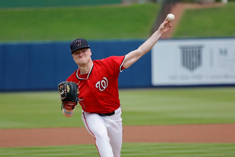 Feb 26, 2025; West Palm Beach, Florida, USA; Washington Nationals pitcher DJ Herz (77) throws a pitch before the first inning  against the Houston Astros at CACTI Park of the Palm Beaches. Mandatory Credit: Reinhold Matay-Imagn Images