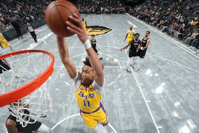 MEMPHIS, TN - MARCH 27: Jaxson Hayes #11 Of the Los Angeles Lakers dunks the ball during the game against the Memphis Grizzlies on March 27, 2024 at FedExForum in Memphis, Tennessee. NOTE TO USER: User expressly acknowledges and agrees that, by downloading and or using this photograph, User is consenting to the terms and conditions of the Getty Images License Agreement. Mandatory Copyright Notice: Copyright 2024 NBAE (Photo by Joe Murphy/NBAE via Getty Images)