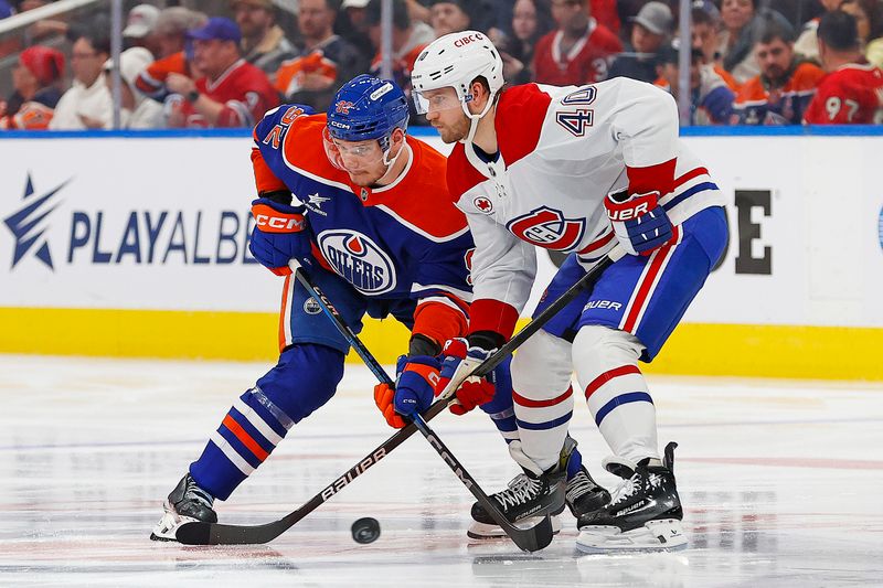 Mar 6, 2025; Edmonton, Alberta, CAN; Edmonton Oilers forward Vasily Podkolzin (92) and Montreal Canadiens forward Joel Armia (40) battle for a loose puck during the third period at Rogers Place. Mandatory Credit: Perry Nelson-Imagn Images