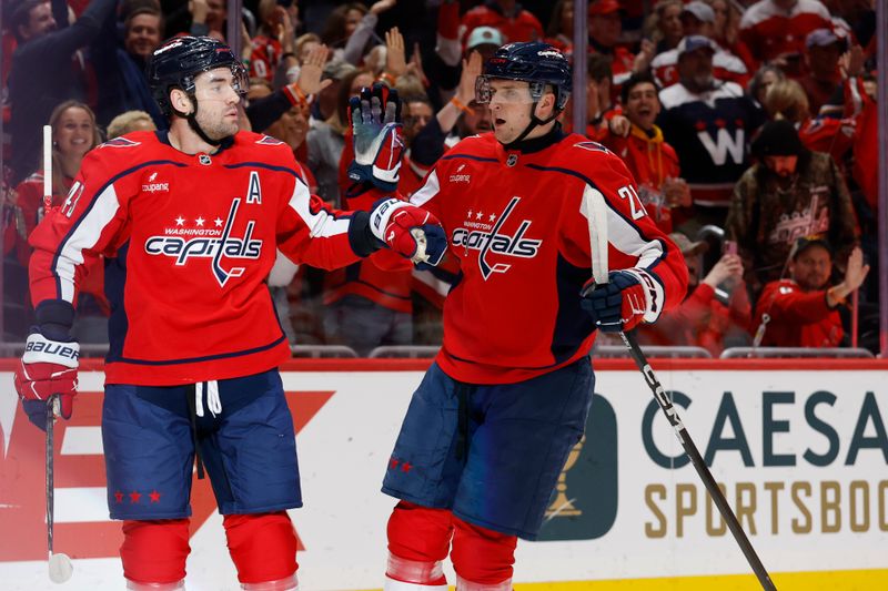 Mar 9, 2026; Washington, District of Columbia, USA; Washington Capitals right wing Tom Wilson (43) celebrates with Capitals left wing Aliaksei Protas (21) after scoring a goal against the Calgary Flames during the first period at Capital One Arena. Mandatory Credit: Geoff Burke-Imagn Images
