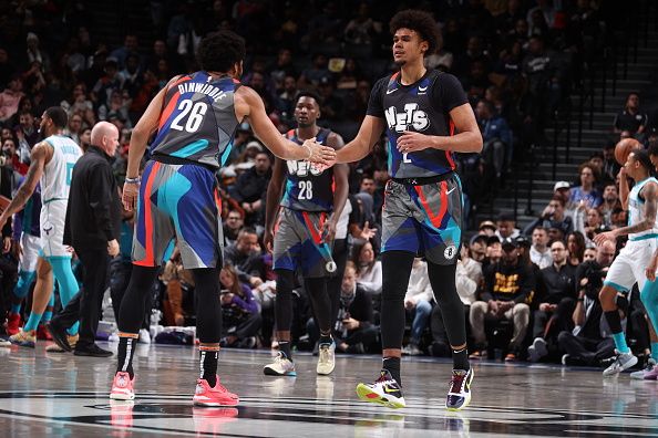 BROOKLYN, NY - NOVEMBER 30: Spencer Dinwiddie #26 and Cameron Johnson #2 of the Brooklyn Nets high five during the game against the Charlotte Hornets on November 30, 2023 at Barclays Center in Brooklyn, New York. NOTE TO USER: User expressly acknowledges and agrees that, by downloading and or using this Photograph, user is consenting to the terms and conditions of the Getty Images License Agreement. Mandatory Copyright Notice: Copyright 2023 NBAE (Photo by Nathaniel S. Butler/NBAE via Getty Images)