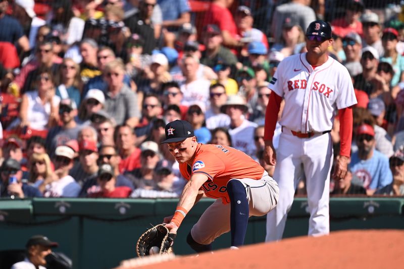 Aug 11, 2024; Boston, Massachusetts, USA; Houston Astros first baseman Zach Dezenzo (9) makes a catch for an out against the Boston Red Sox during the seventh inning at Fenway Park. Mandatory Credit: Eric Canha-USA TODAY Sports