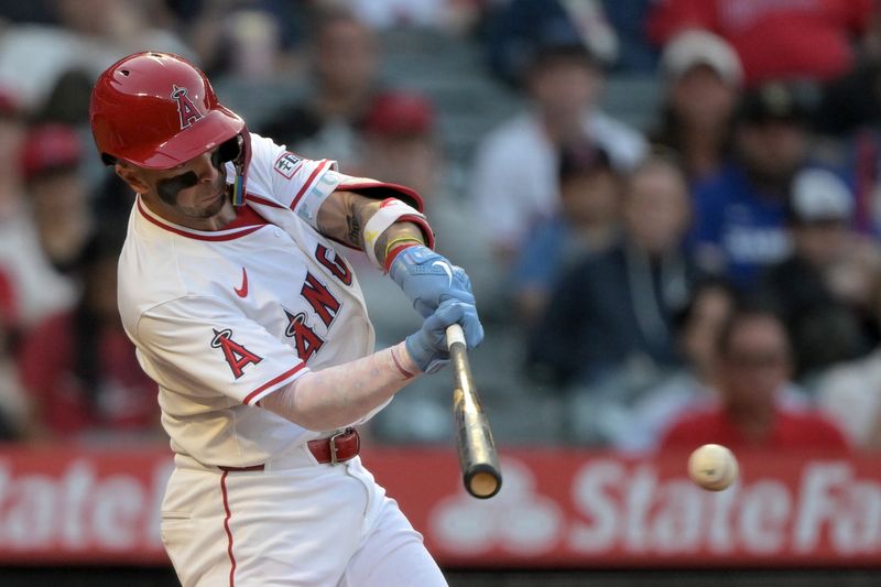 Jun 9, 2025; Anaheim, California, USA;   Los Angeles Angels shortstop Zach Neto (9) hits a RBI single in the third inning against the Athletics at Angel Stadium. Mandatory Credit: Jayne Kamin-Oncea-Imagn Images