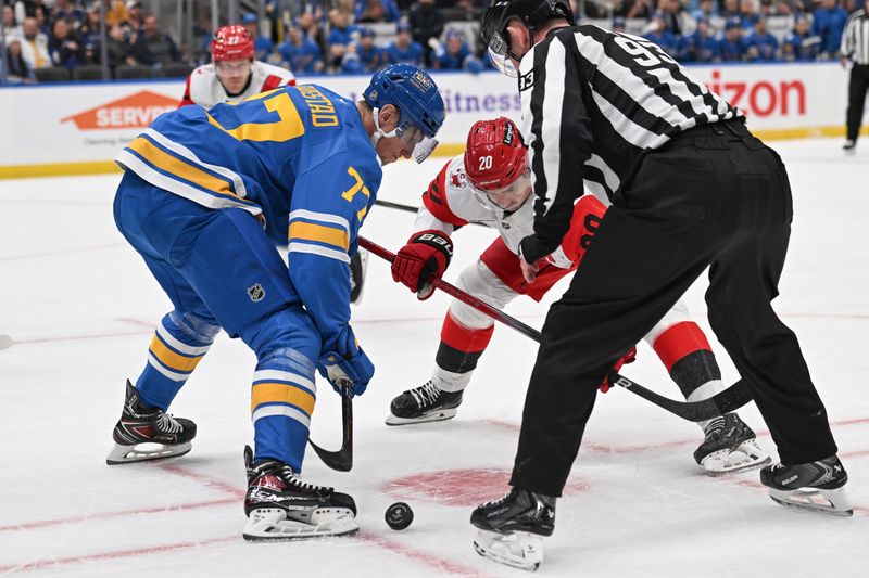 Jan 13, 2026; St. Louis, Missouri, USA; St. Louis Blues center Nick Bjugstad (77) faces off against Carolina Hurricanes center Sebastian Aho (20) in the first period at Enterprise Center. Mandatory Credit: Joe Puetz-Imagn