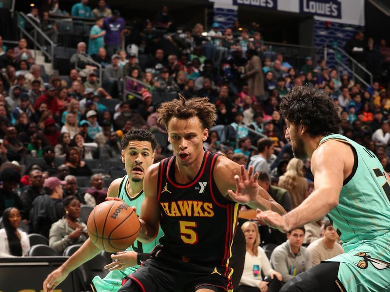 CHARLOTTE, NC - NOVEMBER 30: Dyson Daniels #5 of the Atlanta Hawks dribbles the ball during the game against the Charlotte Hornets on November 30, 2024 at Spectrum Center in Charlotte, North Carolina. NOTE TO USER: User expressly acknowledges and agrees that, by downloading and or using this photograph, User is consenting to the terms and conditions of the Getty Images License Agreement. Mandatory Copyright Notice: Copyright 2024 NBAE (Photo by Kent Smith/NBAE via Getty Images)