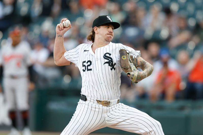 May 23, 2024; Chicago, Illinois, USA; Chicago White Sox starting pitcher Mike Clevinger (52) delivers a pitch against the Baltimore Orioles during the first inning at Guaranteed Rate Field. Mandatory Credit: Kamil Krzaczynski-USA TODAY Sports