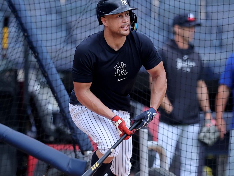 Jul 23, 2024; Bronx, New York, USA; New York Yankees injured designated hitter Giancarlo Stanton (27) works out at Yankee Stadium before a game against the New York Mets. Mandatory Credit: Brad Penner-USA TODAY Sports