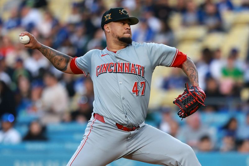 May 17, 2024; Los Angeles, California, USA;  Cincinnati Reds starting pitcher Frankie Montas (47) pitches during the first inning against the Los Angeles Dodgers at Dodger Stadium. Mandatory Credit: Kiyoshi Mio-USA TODAY Sports