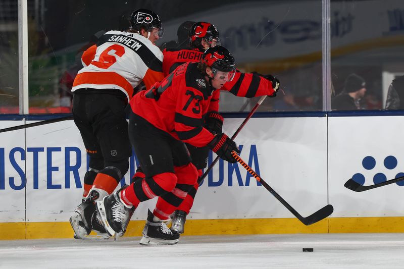 Feb 17, 2024; East Rutherford, New Jersey, USA; New Jersey Devils right wing Tyler Toffoli (73) skates with the puck against the Philadelphia Flyers during the second period in a Stadium Series ice hockey game at MetLife Stadium. Mandatory Credit: Ed Mulholland-USA TODAY Sports