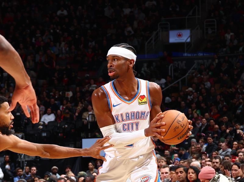 TORONTO, CANADA - MARCH 22:  Shai Gilgeous-Alexander #2 of the Oklahoma City Thunder handles the ball during the game  on March 22, 2024 at the Scotiabank Arena in Toronto, Ontario, Canada.  NOTE TO USER: User expressly acknowledges and agrees that, by downloading and or using this Photograph, user is consenting to the terms and conditions of the Getty Images License Agreement.  Mandatory Copyright Notice: Copyright 2024 NBAE (Photo by Vaughn Ridley/NBAE via Getty Images)