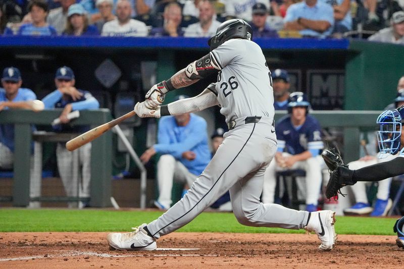 Jul 19, 2024; Kansas City, Missouri, USA; Chicago White Sox catcher Korey Lee (26) hits a solo home run abasing the Kansas City Royals in the eighth inning at Kauffman Stadium. Mandatory Credit: Denny Medley-USA TODAY Sports