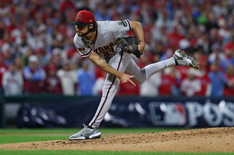 Oct 16, 2023; Philadelphia, Pennsylvania, USA; Arizona Diamondbacks starting pitcher Zac Gallen (23) pitches during the first inning against the Philadelphia Phillies in game one of the NLCS for the 2023 MLB playoffs at Citizens Bank Park. Mandatory Credit: Bill Streicher-USA TODAY Sports