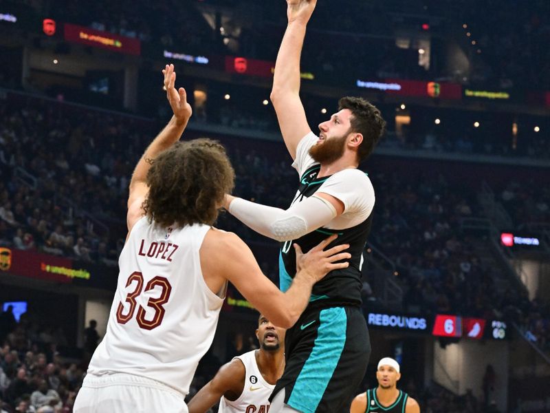 CLEVELAND, OHIO - NOVEMBER 23: Jusuf Nurkic #27 of the Portland Trail Blazers shoots over Robin Lopez #33 of the Cleveland Cavaliers during the first half at Rocket Mortgage Fieldhouse on November 23, 2022 in Cleveland, Ohio. NOTE TO USER: User expressly acknowledges and agrees that, by downloading and or using this photograph, User is consenting to the terms and conditions of the Getty Images License Agreement. (Photo by Jason Miller/Getty Images)