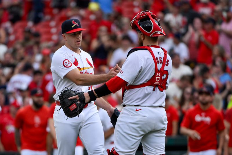 Sep 22, 2024; St. Louis, Missouri, USA; St. Louis Cardinals relief pitcher Ryan Helsley (56) celebrates with catcher Pedro Pages (43) after the Cardinals defeated the Cleveland Guardians at Busch Stadium. Mandatory Credit: Jeff Curry-Imagn Images