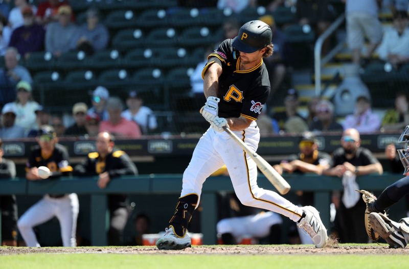 Mar 11, 2025; Bradenton, Florida, USA;  Pittsburgh Pirates second base Adam Frazier (26) hits a 2-RBI double during the fourth inning against the New York Yankees at LECOM Park. Mandatory Credit: Kim Klement Neitzel-Imagn Images