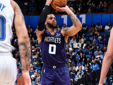 ORLANDO, FL - NOVEMBER 26: Miles Bridges #0 of the Charlotte Hornets shoots a three point basket during the game against the Orlando Magic on November 26, 2023 at Amway Center in Orlando, Florida. NOTE TO USER: User expressly acknowledges and agrees that, by downloading and or using this photograph, User is consenting to the terms and conditions of the Getty Images License Agreement. Mandatory Copyright Notice: Copyright 2023 NBAE (Photo by Gary Bassing/NBAE via Getty Images)