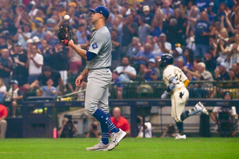 Aug 15, 2024; Milwaukee, Wisconsin, USA; Los Angeles Dodgers starting pitcher Jack Flaherty (0) reacts after giving up a solo home run to Milwaukee Brewers catcher William Contreras (24) in the first inning at American Family Field. Mandatory Credit: Benny Sieu-USA TODAY Sports