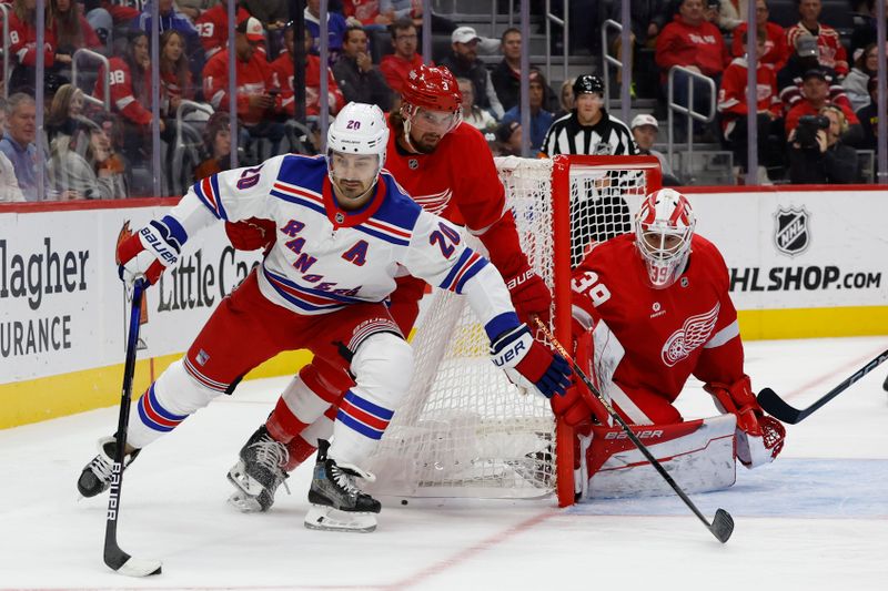 Oct 17, 2024; Detroit, Michigan, USA;  New York Rangers left wing Chris Kreider (20) skates with the puck chased by Detroit Red Wings defenseman Justin Holl (3) in the first period at Little Caesars Arena. Mandatory Credit: Rick Osentoski-Imagn Images