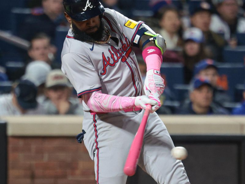 May 12, 2024; New York City, New York, USA; Atlanta Braves designated hitter Marcell Ozuna (20) hits an RBI single during the eighth inning against the New York Mets at Citi Field. Mandatory Credit: Vincent Carchietta-USA TODAY Sports