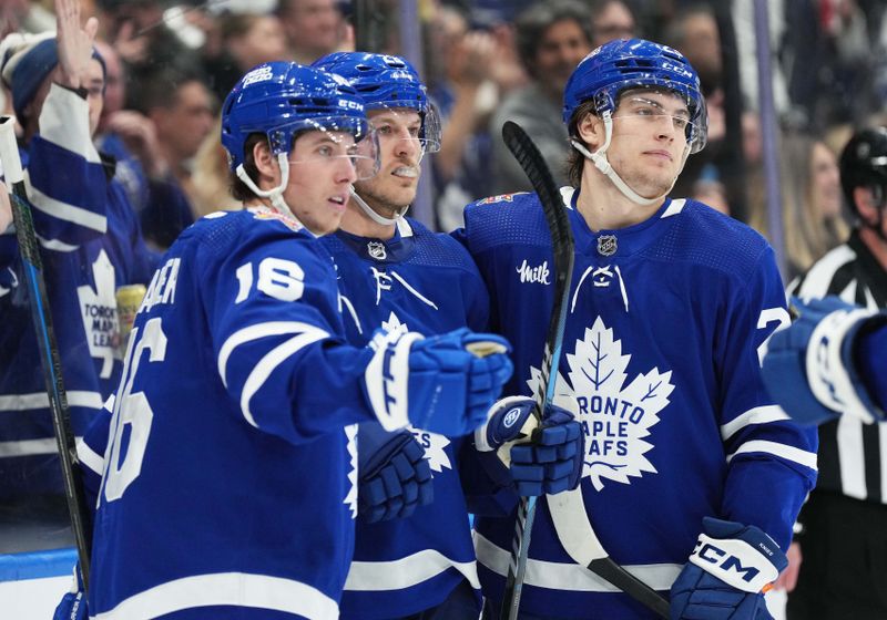 Jan 9, 2024; Toronto, Ontario, CAN; Toronto Maple Leafs defenseman Jake McCabe (22) scores a goal and celebrates with right wing Mitchell Marner (16)] against the San Jose Sharks during the third period at Scotiabank Arena. Mandatory Credit: Nick Turchiaro-USA TODAY Sports