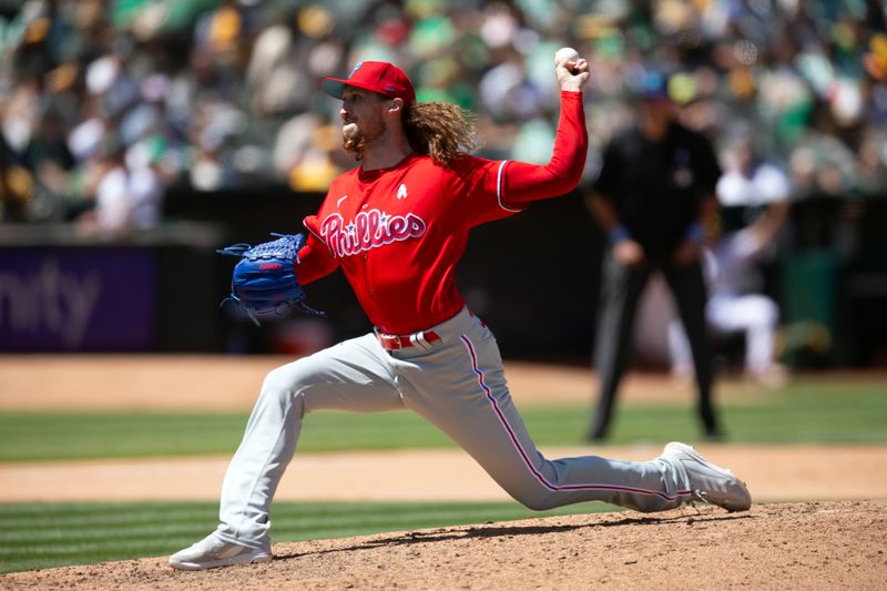 Jun 18, 2023; Oakland, California, USA; Philadelphia Phillies pitcher Matt Strahm (25) delivers a pitch against the Oakland Athletics during the seventh inning at Oakland-Alameda County Coliseum. Mandatory Credit: D. Ross Cameron-USA TODAY Sports