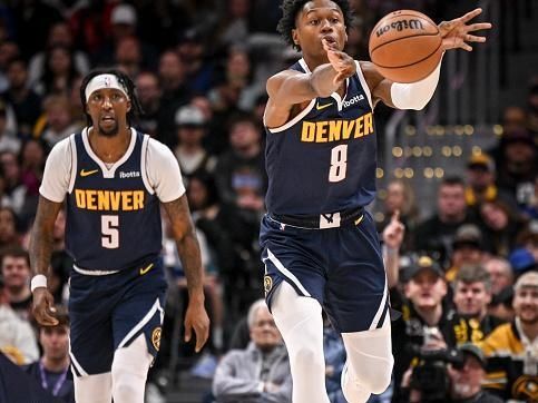 DENVER, CO - JANUARY 1: Peyton Watson (8) of the Denver Nuggets passes in transition against the Charlotte Hornets during the third quarter at Ball Arena in Denver on Monday, January 1, 2024. (Photo by AAron Ontiveroz/The Denver Post)