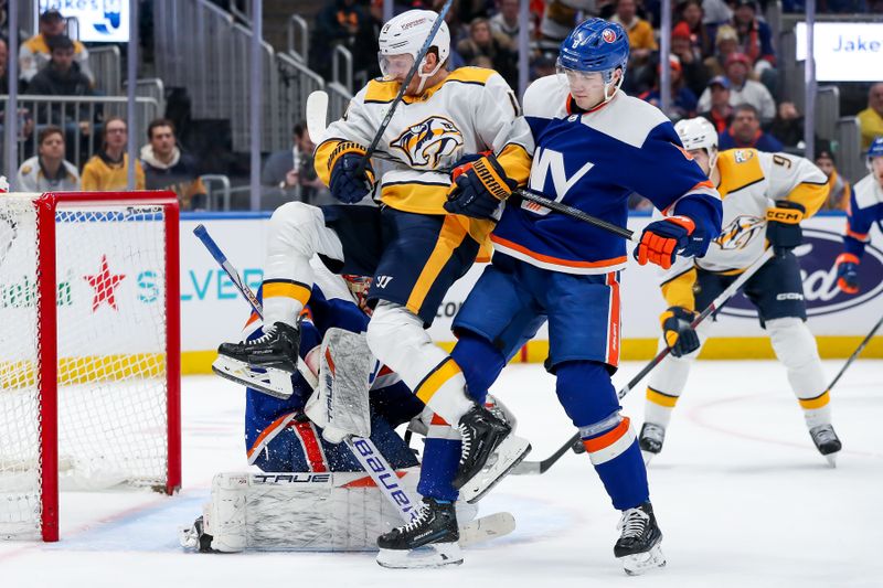 Apr 6, 2024; Elmont, New York, USA; New York Islanders defenseman Noah Dobson (8) defends Nashville Predators center Gustav Nyquist (14) during the third period at UBS Arena. Mandatory Credit: Tom Horak-USA TODAY Sports