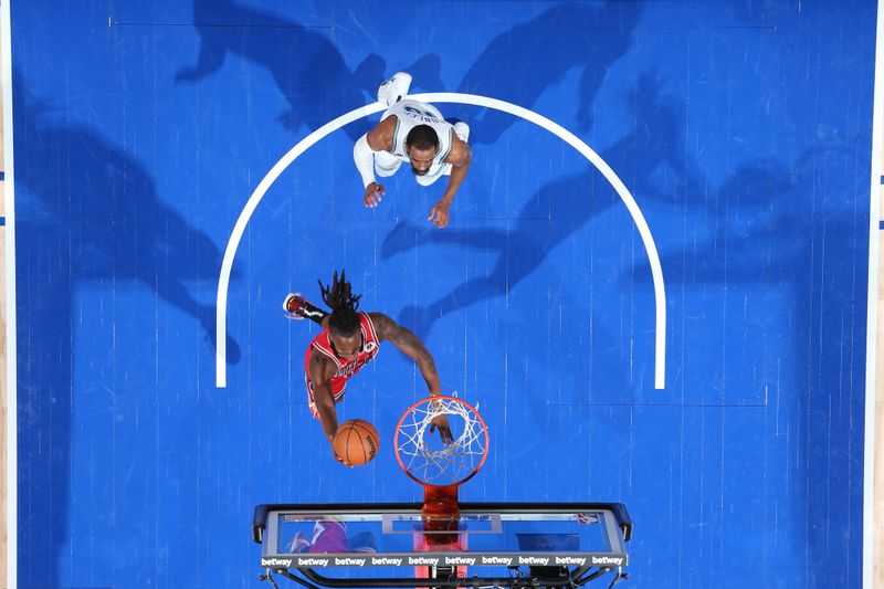 MINNEAPOLIS, MN -  MARCH 31: Ayo Dosunmu #12 of the Chicago Bulls drives to the basket during the game against the Minnesota Timberwolves on March 31, 2024 at Target Center in Minneapolis, Minnesota. NOTE TO USER: User expressly acknowledges and agrees that, by downloading and or using this Photograph, user is consenting to the terms and conditions of the Getty Images License Agreement. Mandatory Copyright Notice: Copyright 2024 NBAE (Photo by David Sherman/NBAE via Getty Images)