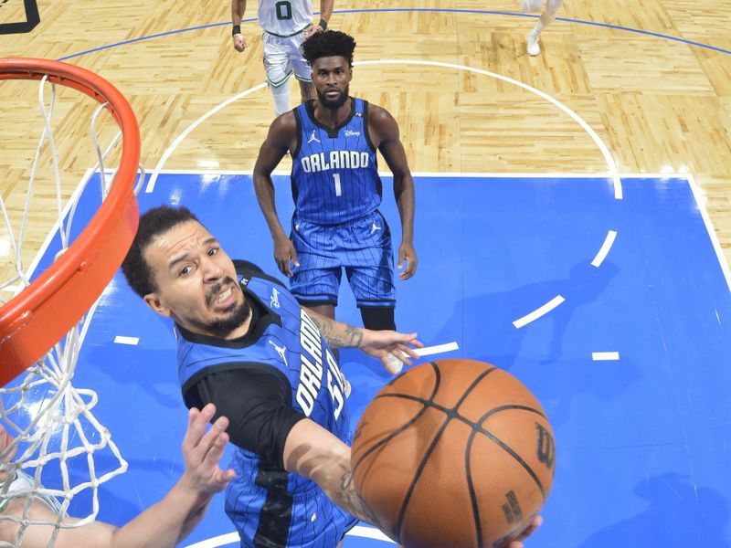 ORLANDO, FL - APRIL 25: Cole Anthony #50 of the Orlando Magic drives to the basket during Round One, Game Three of the 2025 NBA Playoffs against the Boston Celtics on April 25, 2025 at Kia Center in Orlando, Florida. NOTE TO USER: User expressly acknowledges and agrees that, by downloading and or using this photograph, User is consenting to the terms and conditions of the Getty Images License Agreement. Mandatory Copyright Notice: Copyright 2025 NBAE (Photo by Fernando Medina/NBAE via Getty Images)
