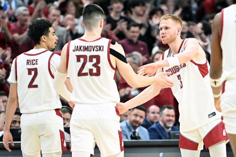 Mar 21, 2024; Omaha, NE, USA; Washington State Cougars guard Jabe Mullins (3) and forward Andrej Jakimovski (23) and guard Myles Rice (2) react in the second half in the first round of the 2024 NCAA Tournament at CHI Health Center Omaha. Mandatory Credit: Steven Branscombe-USA TODAY Sports