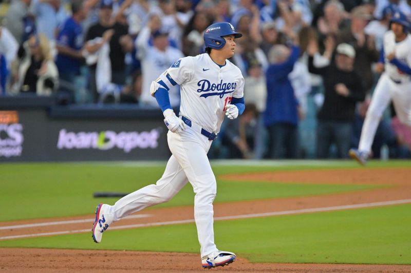 Oct 17, 2025; Los Angeles, California, USA; Los Angeles Dodgers two-way player Shohei Ohtani (17) rounds the bases on his solo home run against the Milwaukee Brewers during the first inning of game four of the NLCS round for the 2025 MLB playoffs at Dodger Stadium. Mandatory Credit: Jayne Kamin-Oncea-Imagn Images