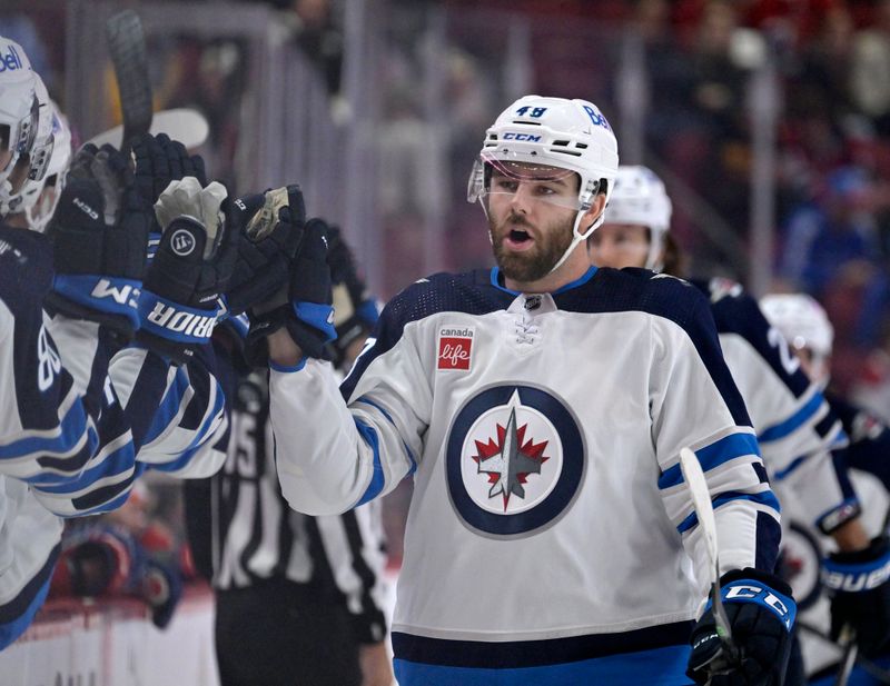 Sep 29, 2022; Montreal, Quebec, CAN; Winnipeg Jets forward Evan Polei(48) celebrates after scoring a goal against the Montreal Canadiens during the first period at the Bell Centre. Mandatory Credit: Eric Bolte-USA TODAY Sports