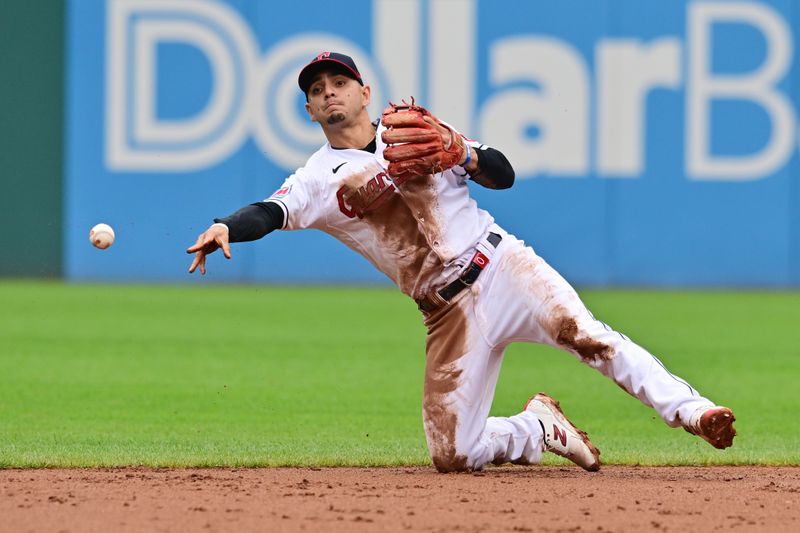 Sep 6, 2023; Cleveland, Ohio, USA; Cleveland Guardians second baseman Andres Gimenez (0) throws to second to force out Minnesota Twins third baseman Royce Lewis (not pictured) during the sixth inning at Progressive Field. Mandatory Credit: Ken Blaze-USA TODAY Sports