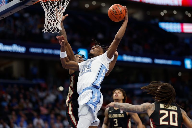 Mar 14, 2024; Washington, D.C., USA; North Carolina forward Jae'Lyn Withers (24) attempts to dunk the ball as Florida State forward Jamir Watkins (2) defends in the second half at Capital One Arena. Mandatory Credit: Geoff Burke-USA TODAY Sports