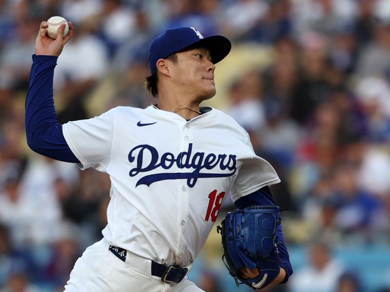 Jun 1, 2024; Los Angeles, California, USA;  Los Angeles Dodgers starting pitcher Yoshinobu Yamamoto (18) pitches during the first inning against the Colorado Rockies at Dodger Stadium. Mandatory Credit: Kiyoshi Mio-USA TODAY Sports