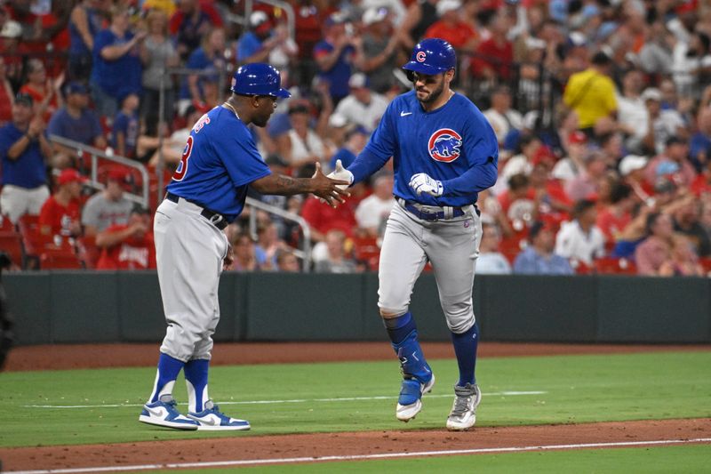 Jul 27, 2023; St. Louis, Missouri, USA; Chicago Cubs center fielder Mike Tauchman (40) is congratulated by third base coach Willie Harris (33) after Tuchman hits a solo home run against the St. Louis Cardinals in the fifth inning at Busch Stadium. Mandatory Credit: Joe Puetz-USA TODAY Sports