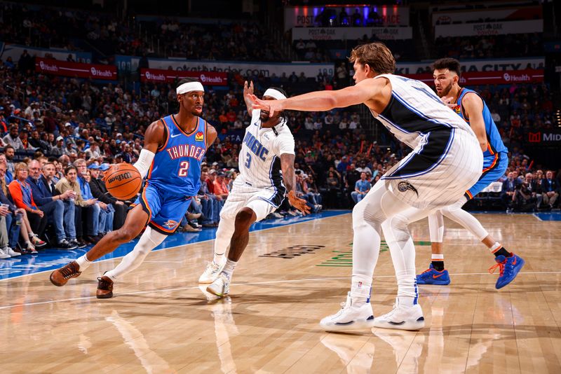 OKLAHOMA CITY, OK - NOVEMBER 4:  Shai Gilgeous-Alexander #2 of the Oklahoma City Thunder dribbles the ball during the game against the Orlando Magic on November 4, 2024 at Paycom Center in Oklahoma City, Oklahoma. NOTE TO USER: User expressly acknowledges and agrees that, by downloading and or using this photograph, User is consenting to the terms and conditions of the Getty Images License Agreement. Mandatory Copyright Notice: Copyright 2024 NBAE (Photo by Zach Beeker/NBAE via Getty Images)