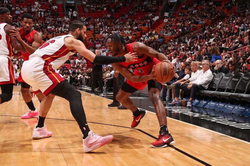 MIAMI, FL - APRIL 12:  Immanuel Quickley #5 of the Toronto Raptors handles the ball during the game against the Miami Heat on April 12, 2024 at Kaseya Center in Miami, Florida. NOTE TO USER: User expressly acknowledges and agrees that, by downloading and or using this Photograph, user is consenting to the terms and conditions of the Getty Images License Agreement. Mandatory Copyright Notice: Copyright 2024 NBAE (Photo by Issac Baldizon/NBAE via Getty Images)