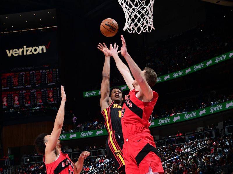 ATLANTA, GA - February 23: De'Andre Hunter #12 of the Atlanta Hawks drives to the basket during the game against the Toronto Raptors on February 23, 2024 at State Farm Arena in Atlanta, Georgia.  NOTE TO USER: User expressly acknowledges and agrees that, by downloading and/or using this Photograph, user is consenting to the terms and conditions of the Getty Images License Agreement. Mandatory Copyright Notice: Copyright 2024 NBAE (Photo by Scott Cunningham/NBAE via Getty Images)