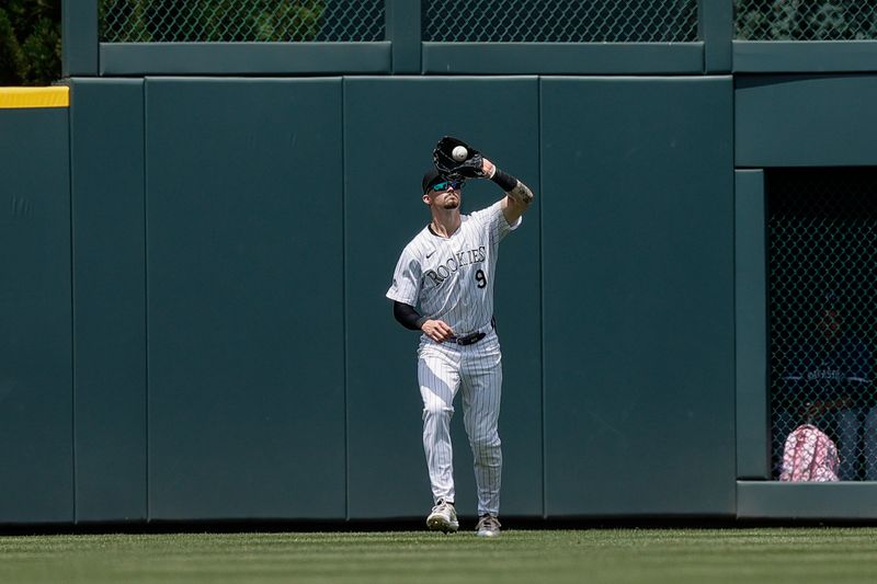 Jul 7, 2024; Denver, Colorado, USA; Colorado Rockies center fielder Brenton Doyle (9) makes a catch for an out in the fifth inning against the Kansas City Royals at Coors Field. Mandatory Credit: Isaiah J. Downing-USA TODAY Sports