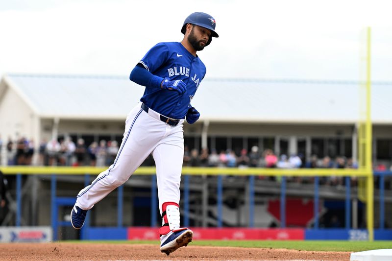 Mar 22, 2024; Dunedin, Florida, USA; Toronto Blue Jays shortstop Isiah Kiner-Falefa (7) rounds the bases after hitting a two run home run in the second inning of a spring training game against the Boston Red Sox at TD Ballpark. Mandatory Credit: Jonathan Dyer-USA TODAY Sports