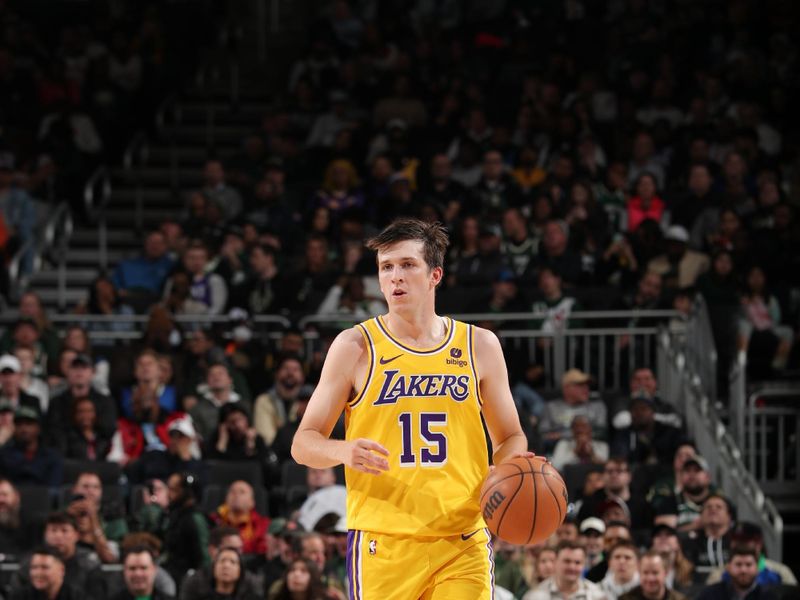 MILWAUKEE, WI - MARCH 26: Austin Reaves #15 of the Los Angeles Lakers dribbles the ball during the game against the Milwaukee Bucks on March 26, 2024 at the Fiserv Forum Center in Milwaukee, Wisconsin. NOTE TO USER: User expressly acknowledges and agrees that, by downloading and or using this Photograph, user is consenting to the terms and conditions of the Getty Images License Agreement. Mandatory Copyright Notice: Copyright 2024 NBAE (Photo by Gary Dineen/NBAE via Getty Images).