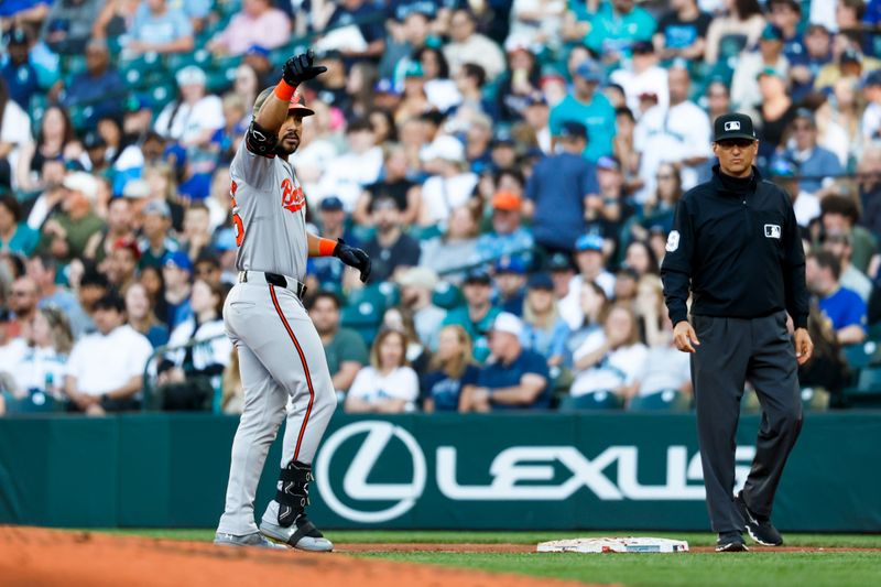 Jul 2, 2024; Seattle, Washington, USA; Baltimore Orioles right fielder Anthony Santander (25) reacts towards the dugout after hitting an RBI-single against the Seattle Mariners during the fourth inning at T-Mobile Park. Mandatory Credit: Joe Nicholson-USA TODAY Sports