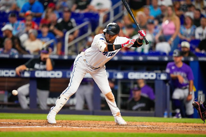 Jul 23, 2023; Miami, Florida, USA; Miami Marlins second baseman Luis Arraez (3) moves out of the way of a pitch against the Colorado Rockies during the sixth inning at loanDepot Park. Mandatory Credit: Rich Storry-USA TODAY Sports