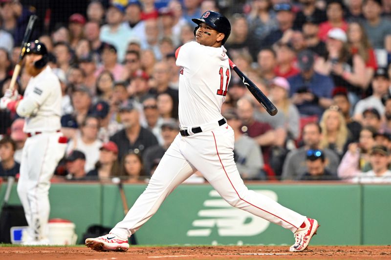 May 31, 2023; Boston, Massachusetts, USA; Boston Red Sox third baseman Rafael Devers (11) watches the ball after hitting a RBI double against the Cincinnati Reds during the third inning at Fenway Park. Mandatory Credit: Brian Fluharty-USA TODAY Sports