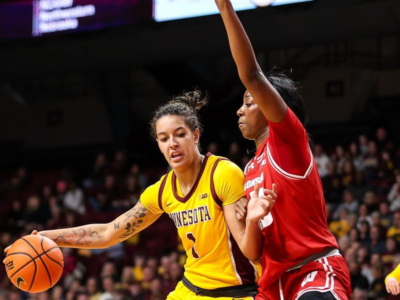 Feb 20, 2024; Minneapolis, Minnesota, USA; Minnesota Golden Gophers forward Ayianna Johnson (1) works around Wisconsin Badgers forward Serah Williams (25) during the first half at Williams Arena. Mandatory Credit: Matt Krohn-USA TODAY Sports