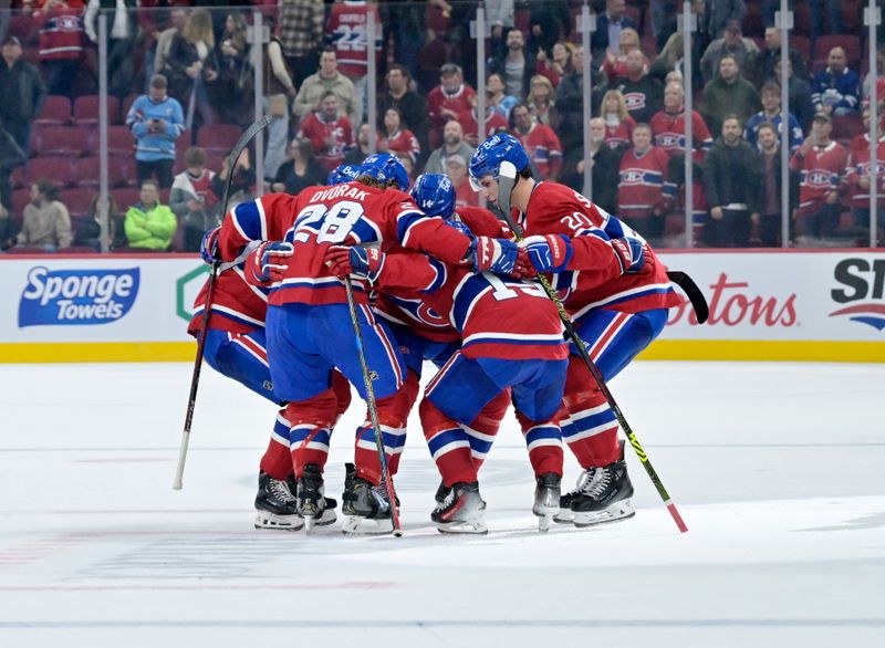 Oct 9, 2024; Montreal, Quebec, CAN; Montreal Canadiens players celebrate the win against the Toronto Maple Leafs at the Bell Centre. Mandatory Credit: Eric Bolte-Imagn Images